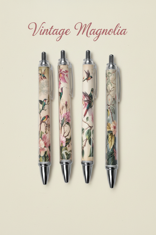 Vintage magnolia and hummingbird floral ballpoint pens on dark cream background with Vintage Magnolia calligraphy heading